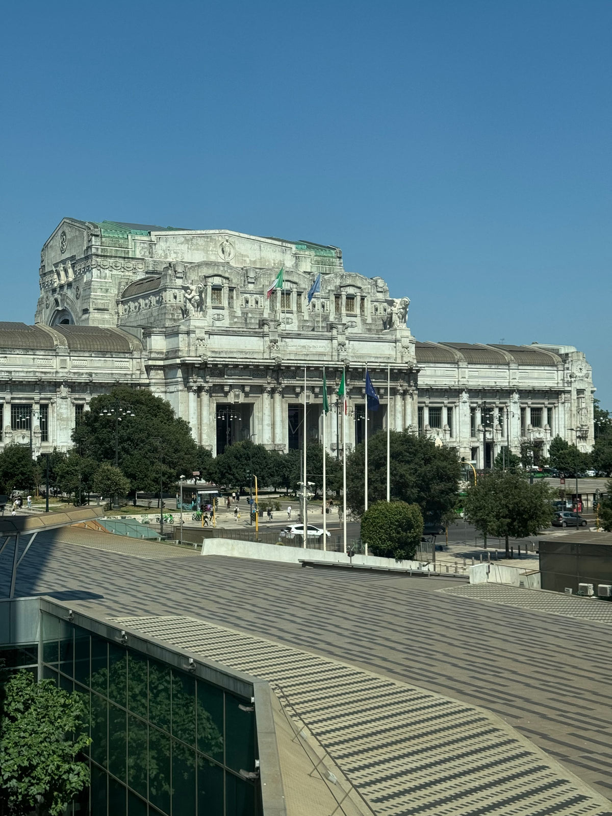 The monumental façade of Milano Centrale on a sunny day