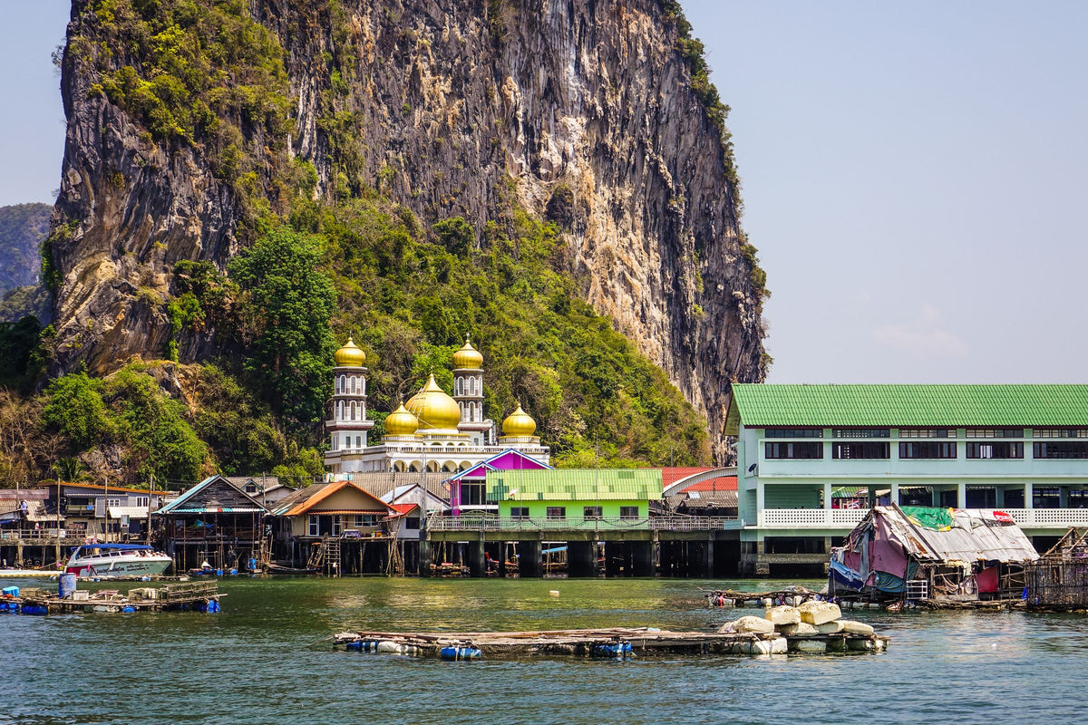 Koh Panyee stilt village and mosque below a limestone cliff