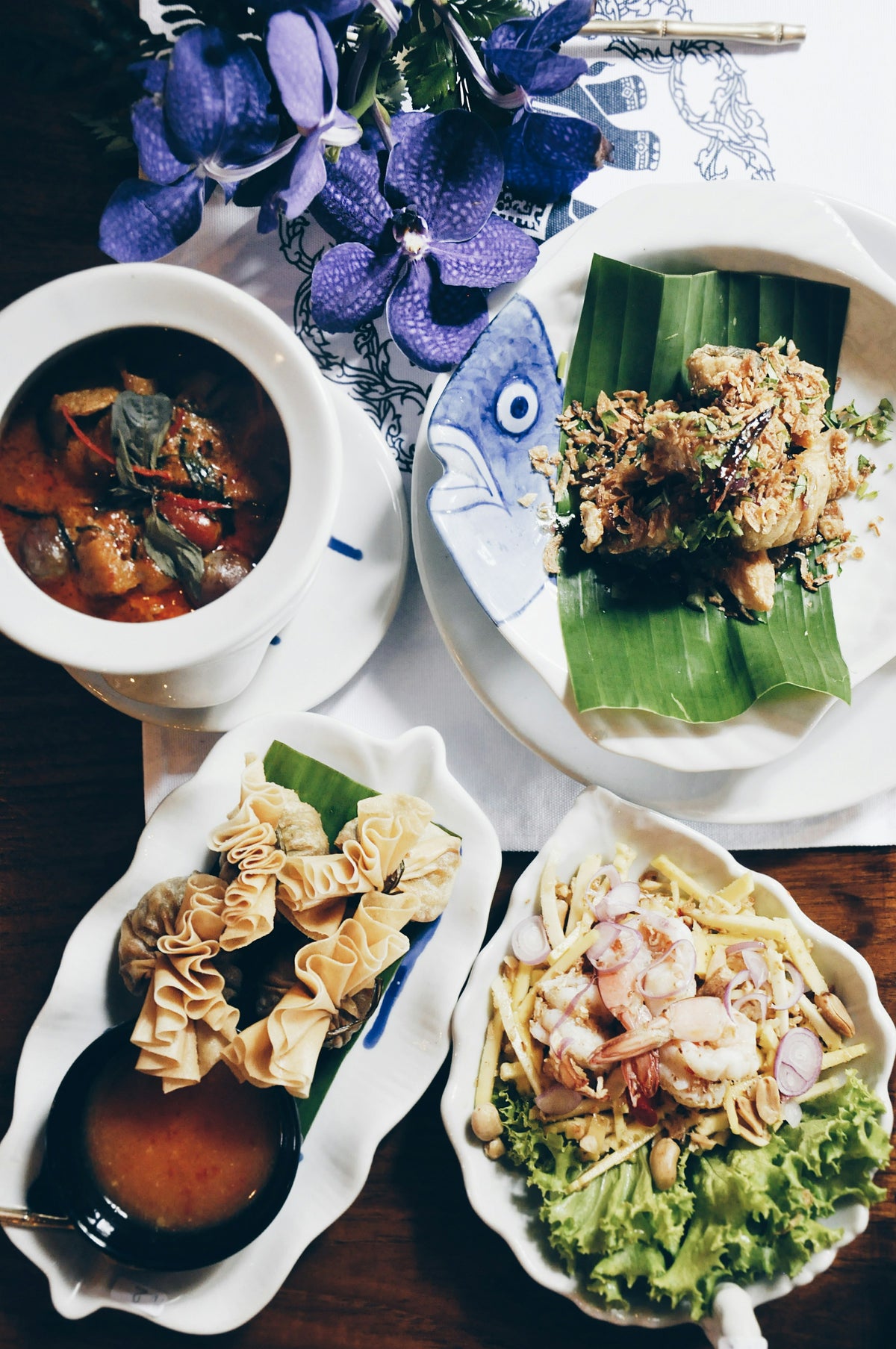Thai dishes including a curry, prawn salad and crispy wontons, Phuket