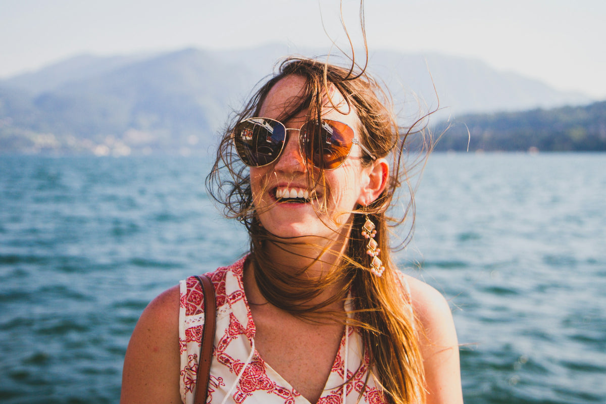 A passenger on the windy ferry crossing from Menaggio to Bellagio