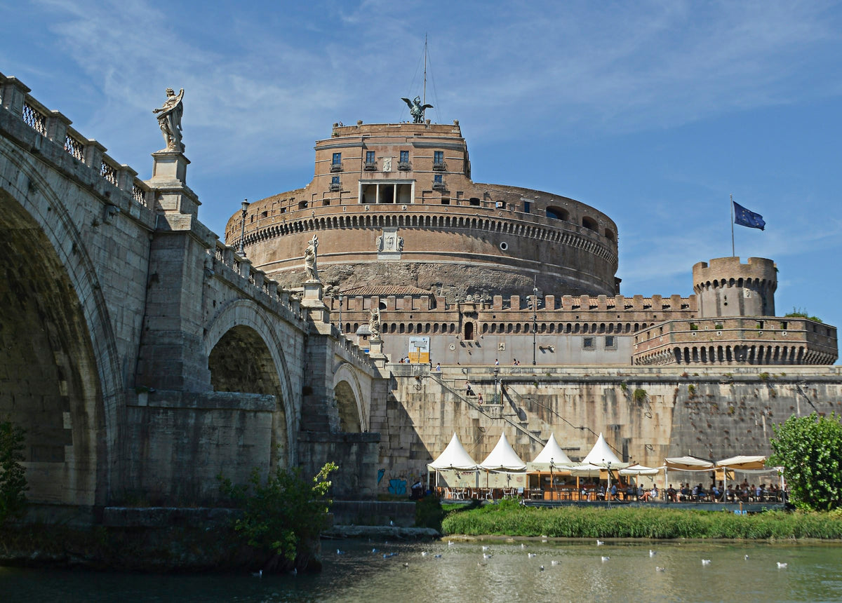 Castel Sant'Angelo above the Tiber, beside the arches of its bridge