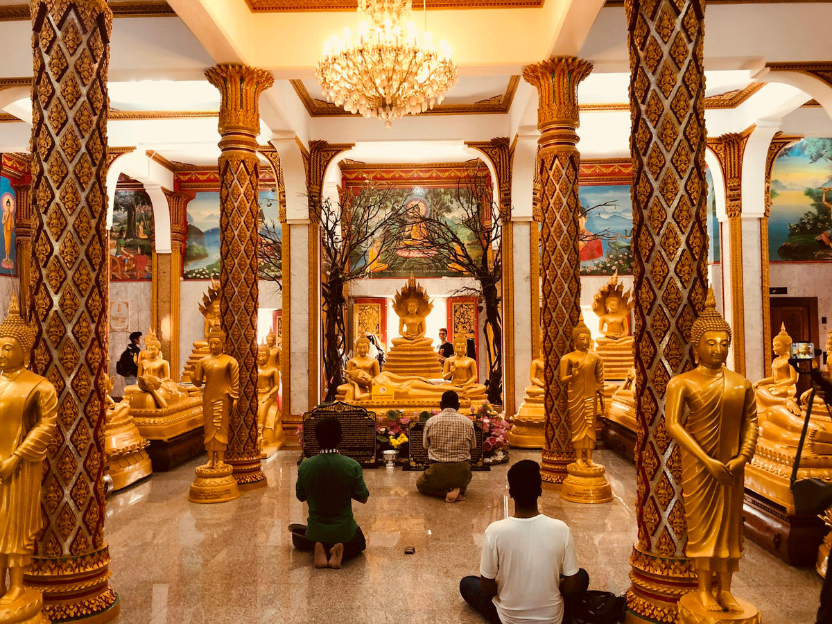 Worshippers inside a Buddhist temple in Phuket