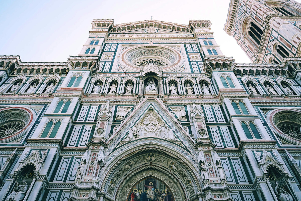 Looking up at the Duomo's carved marble facade