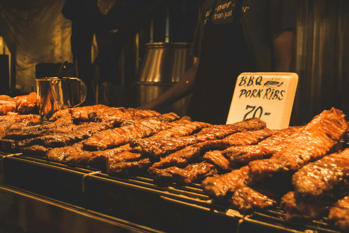 BBQ pork ribs on a street food grill in Phuket