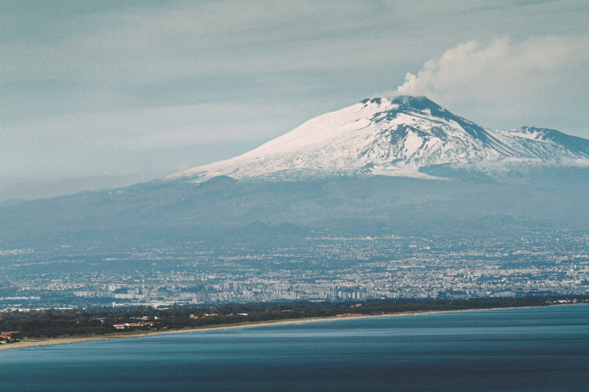 Snowy Etna rising above the Gulf of Catania
