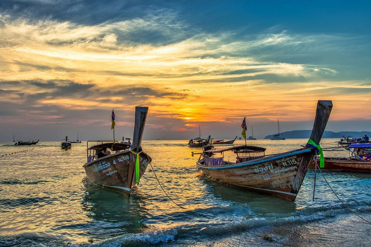 Longtail boats at sunset on the Krabi coast
