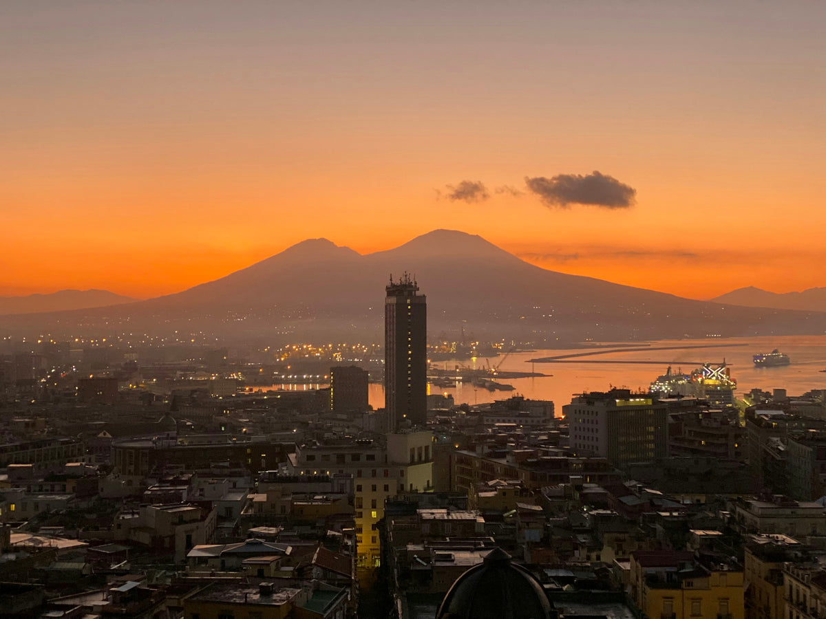 Sunrise behind Vesuvius over the rooftops of Naples