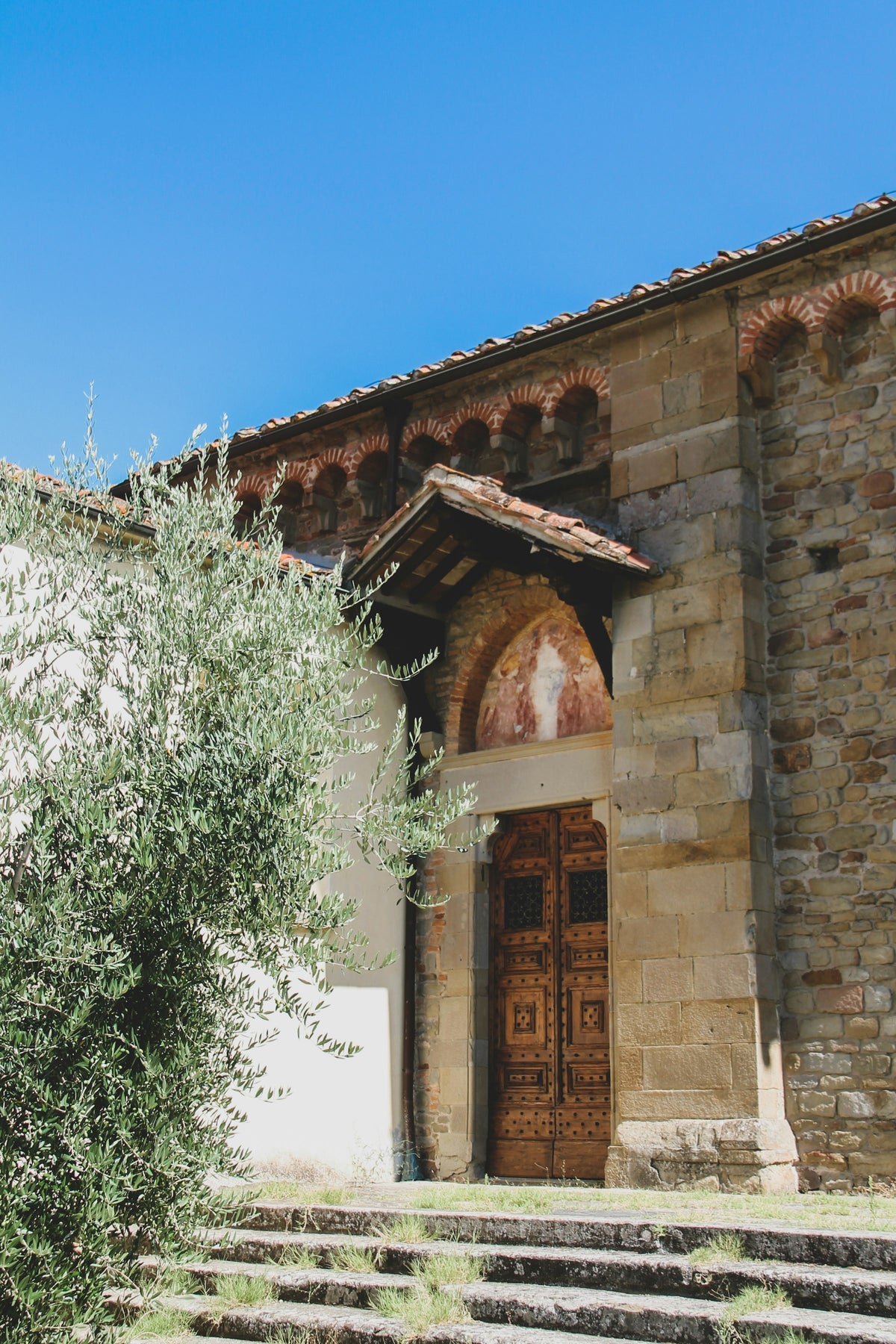 An old stone church doorway in Fiesole