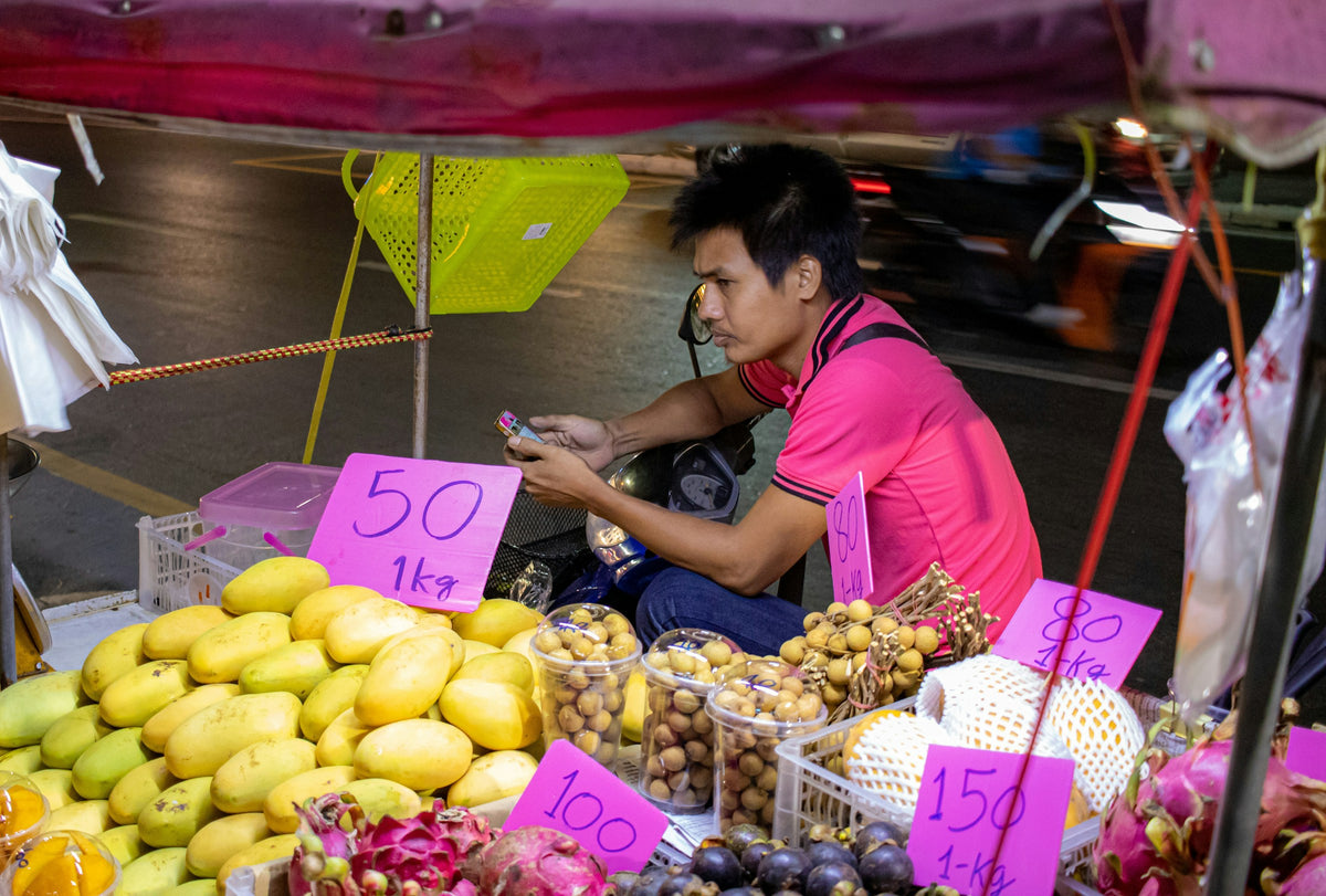 Mangoes, longans and dragon fruit at a night-market fruit stall in Phuket