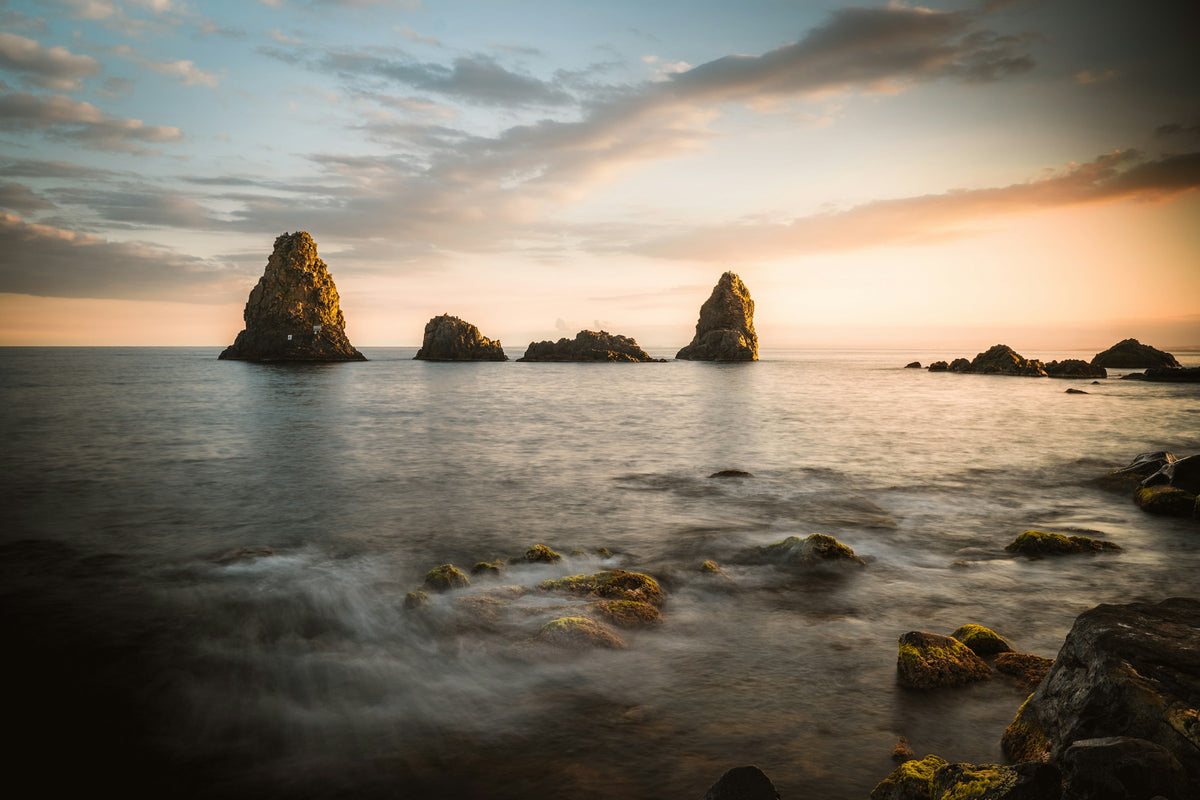 The Cyclops sea stacks of Aci Trezza at sunset