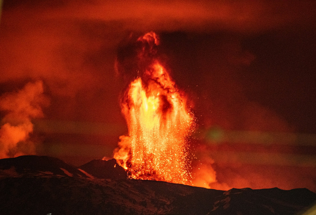 Lava fountain lighting up Etna at night