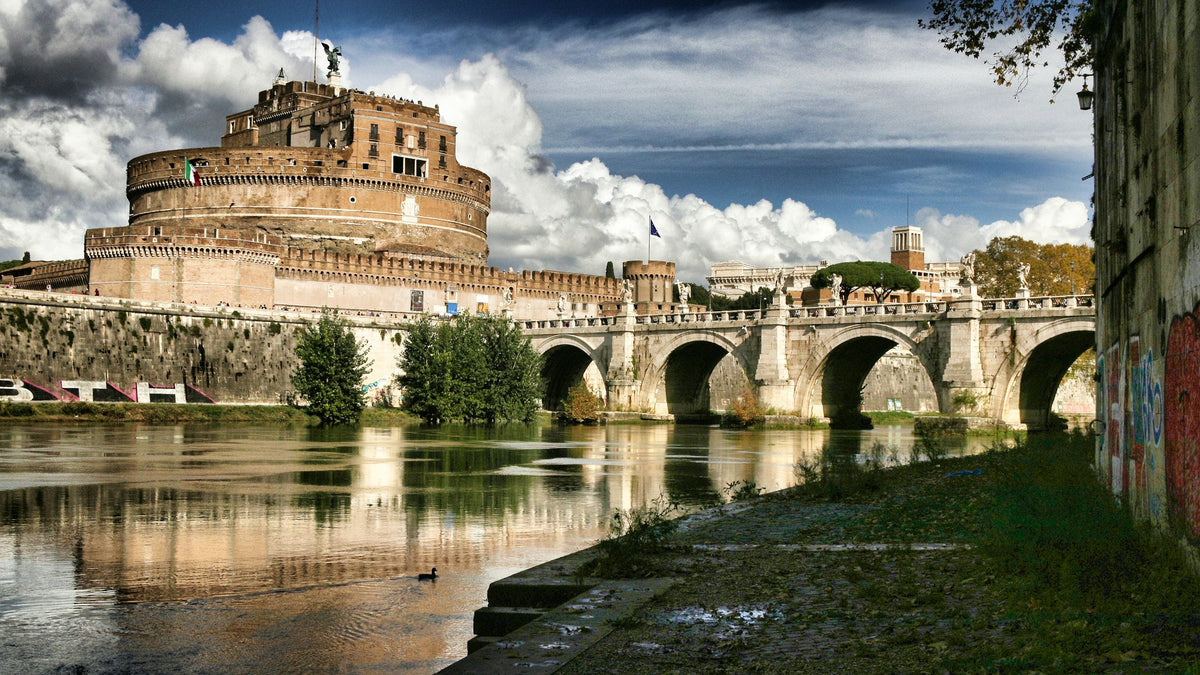Castel Sant'Angelo and its bridge reflected in the Tiber