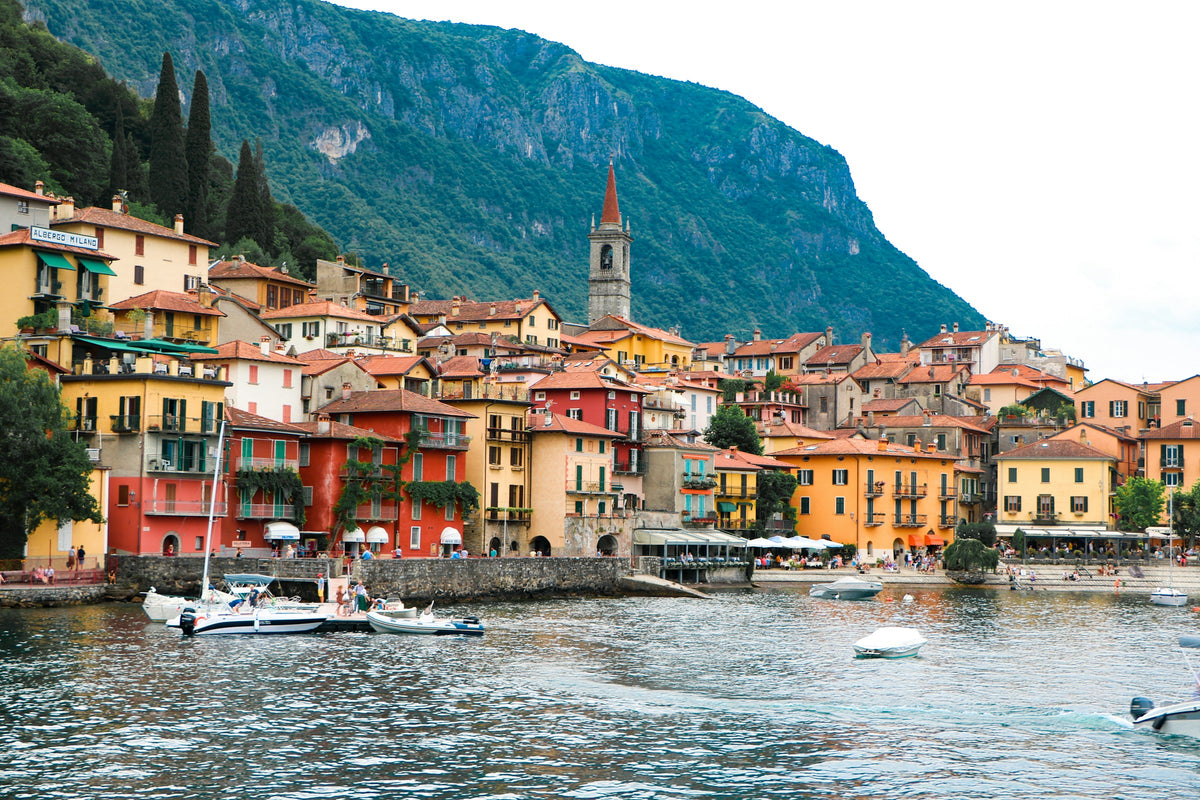 Colourful houses stacked above the water in Bellagio