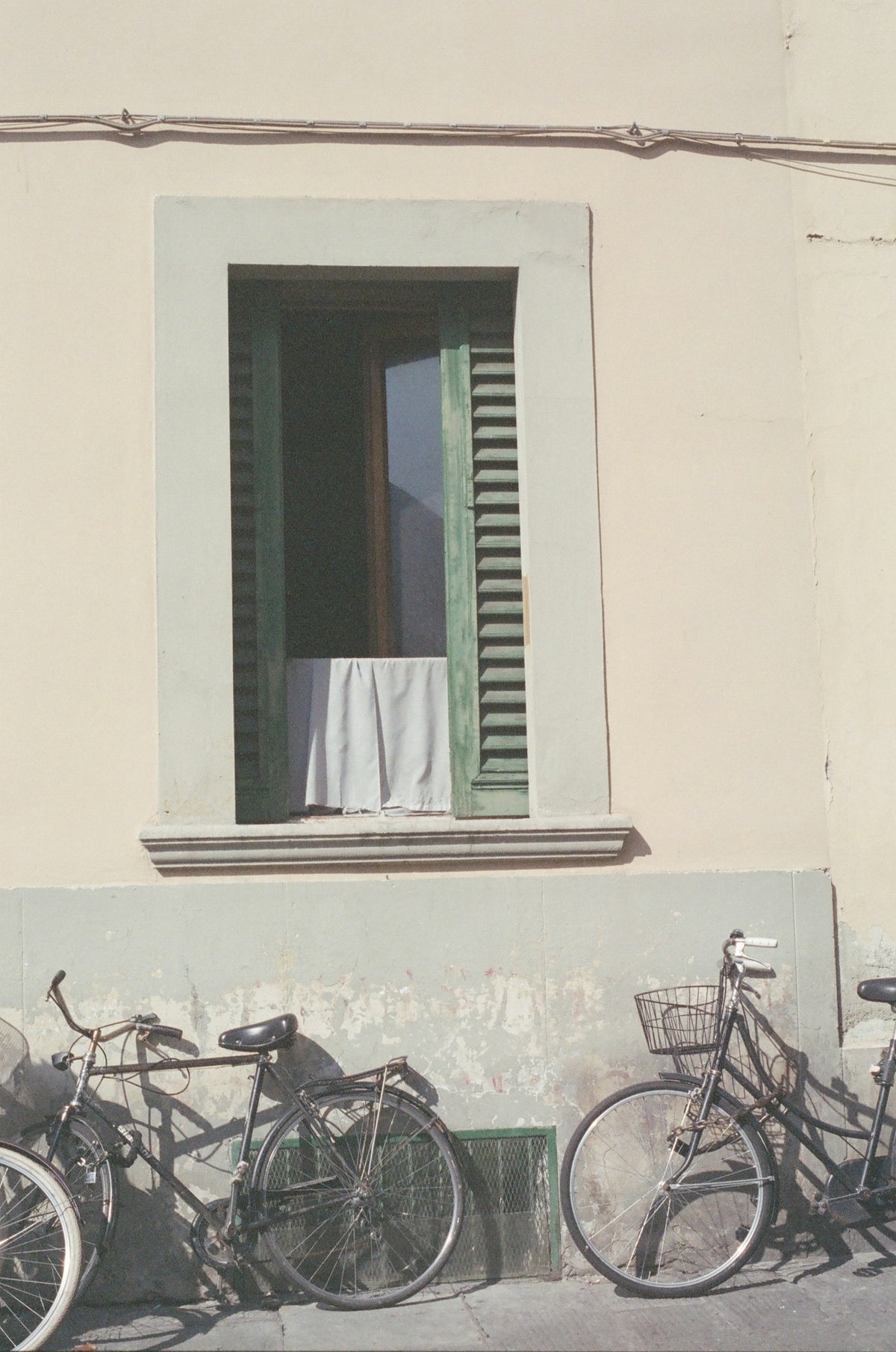 Bicycles parked against an old Florentine building