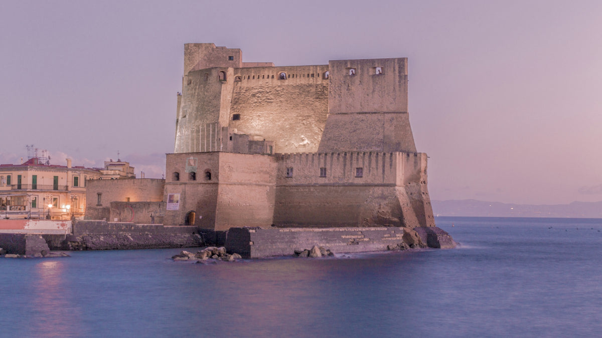 Castel dell'Ovo lit up at dusk