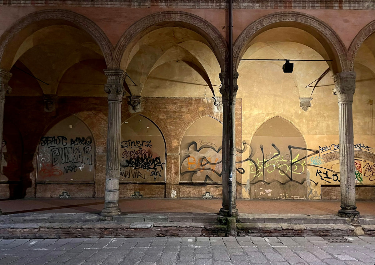 An old building covered in graffiti in Bologna
