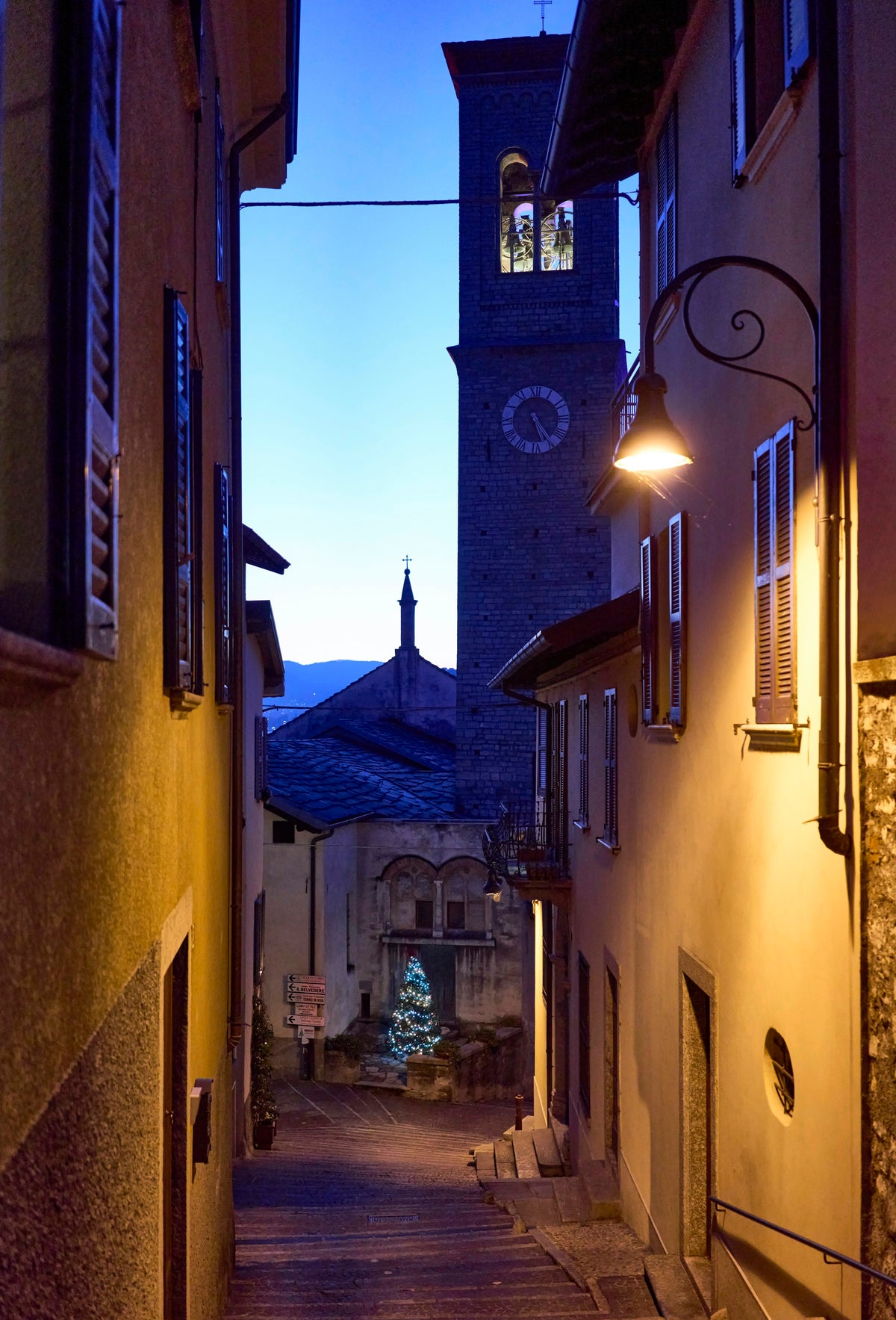 A narrow street leading to the clock tower in Torno