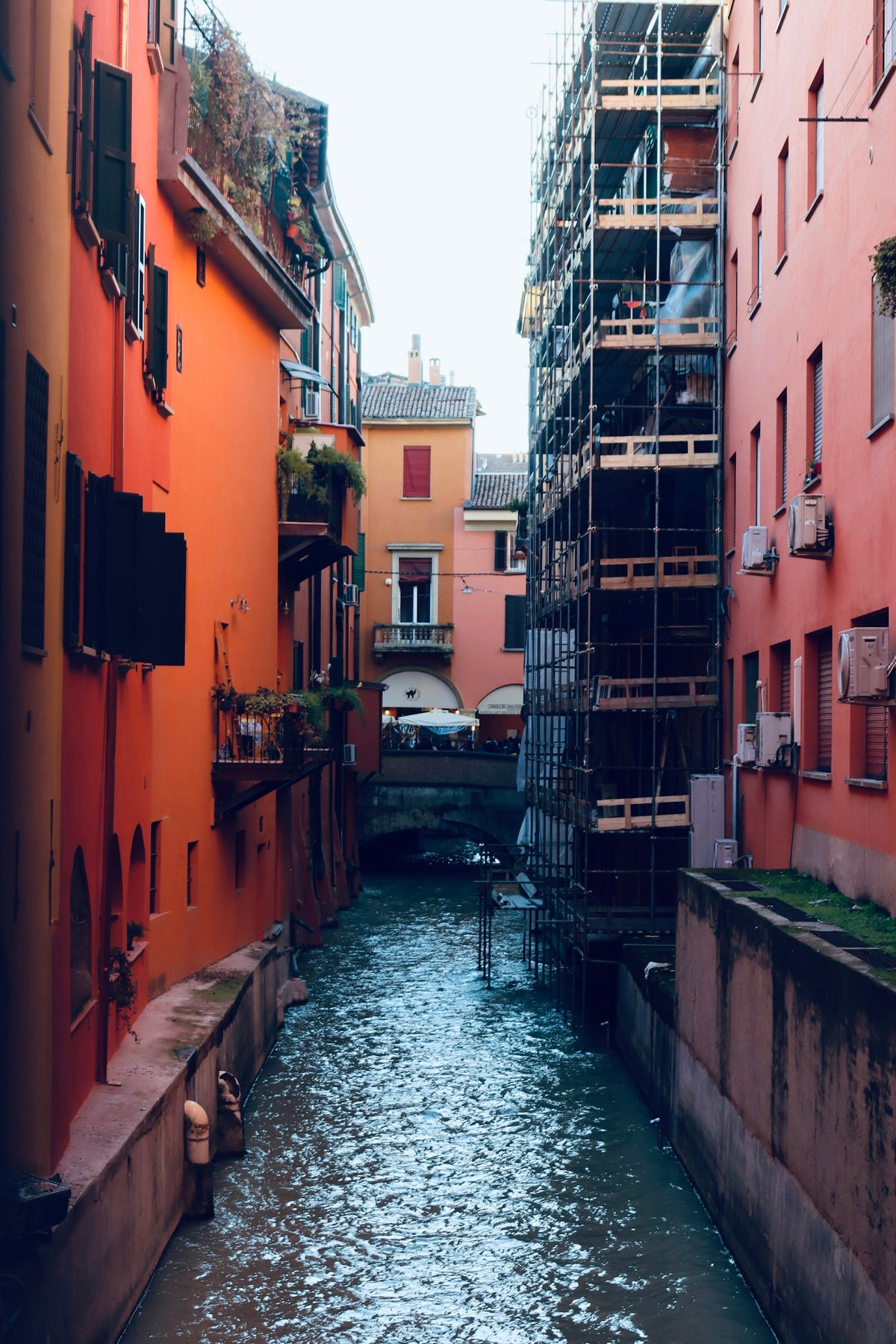 A narrow canal between buildings in Bologna