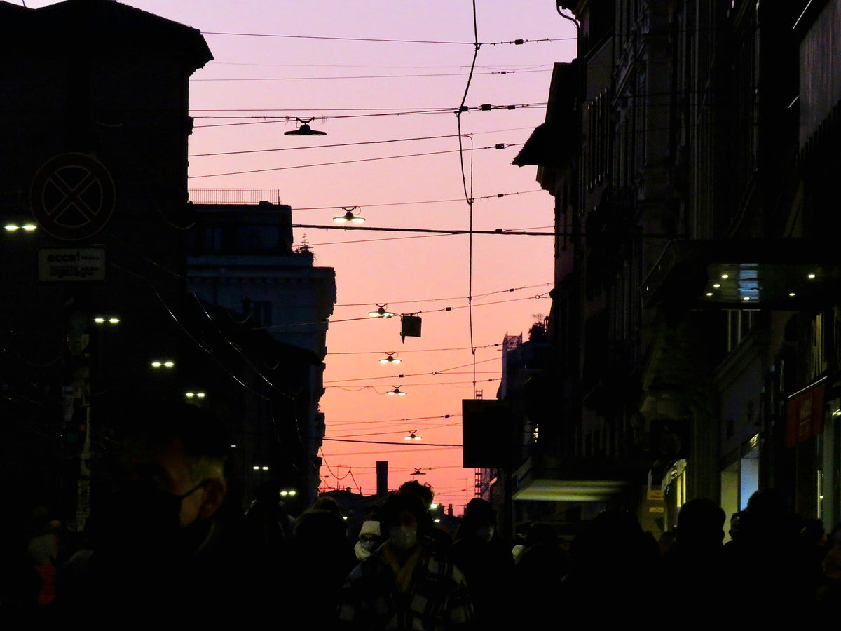 Pedestrians on a busy street in central Bologna