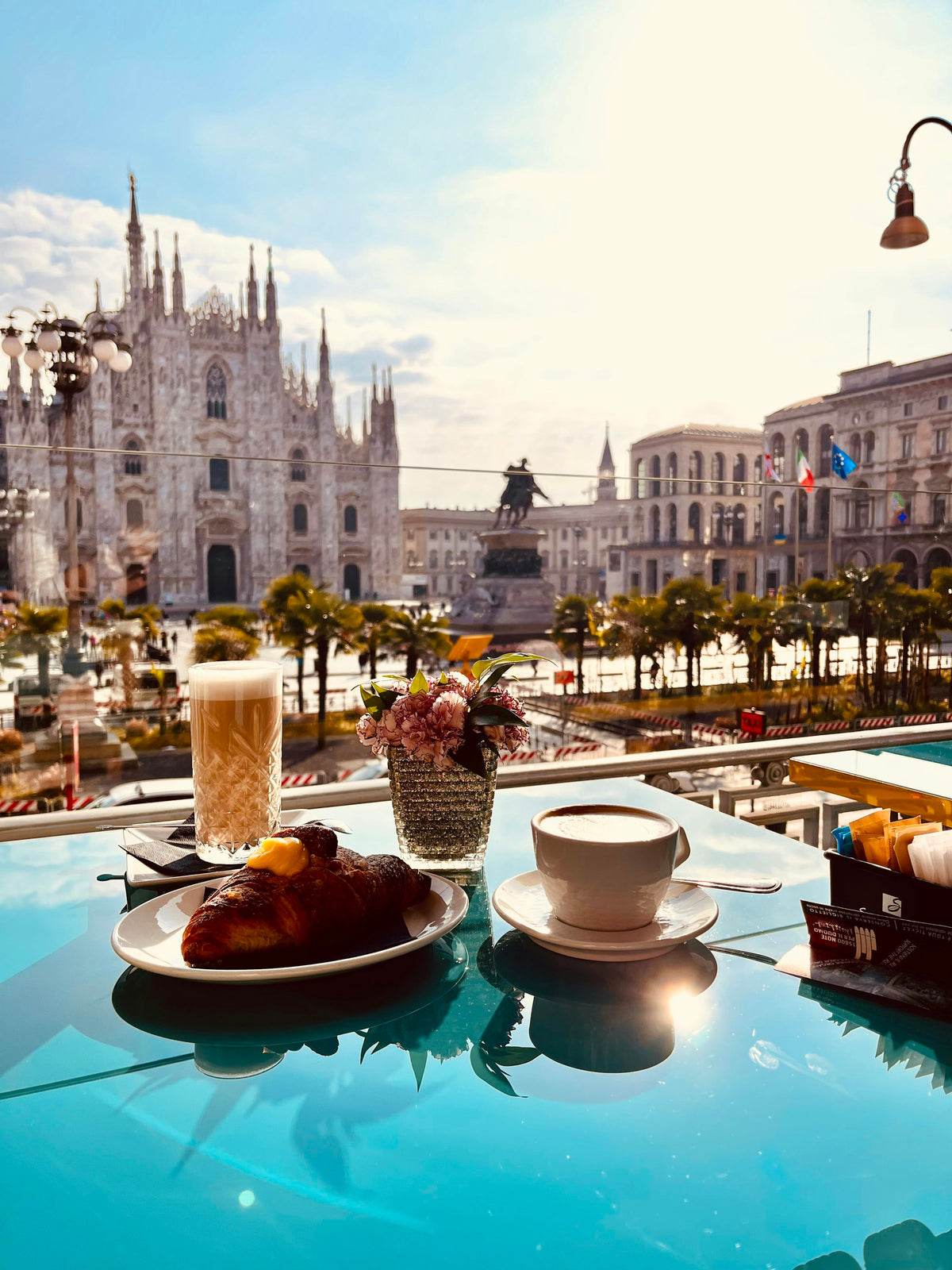 Breakfast plates on a table overlooking the Duomo