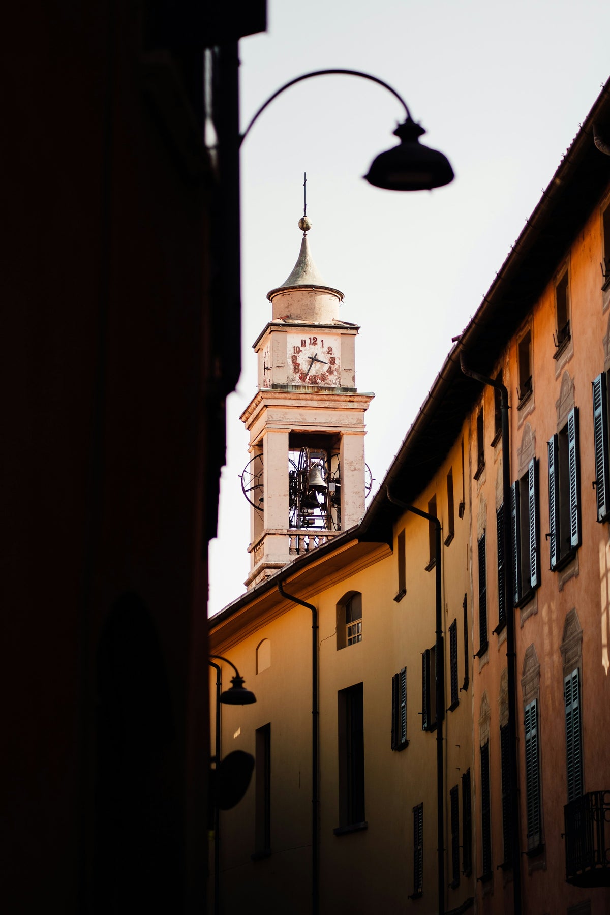 A bell tower above an old-town street