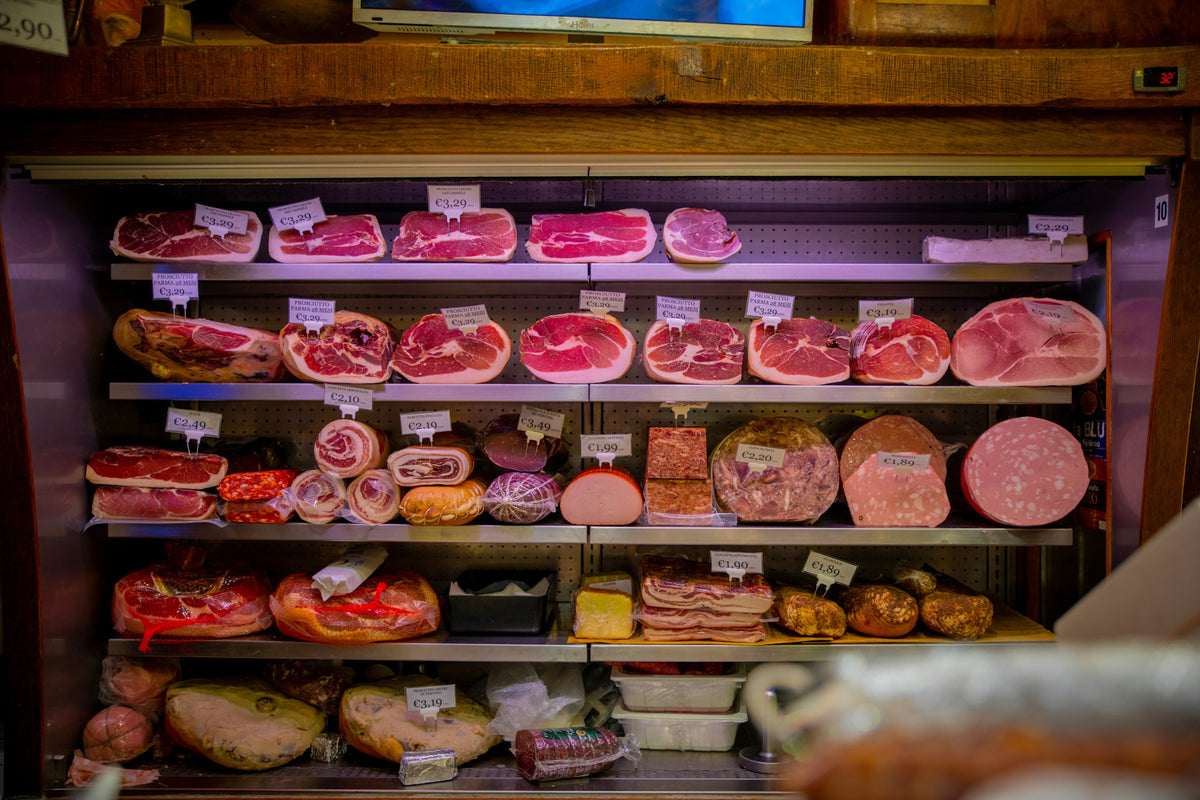 A shop shelf stocked with food in Bologna