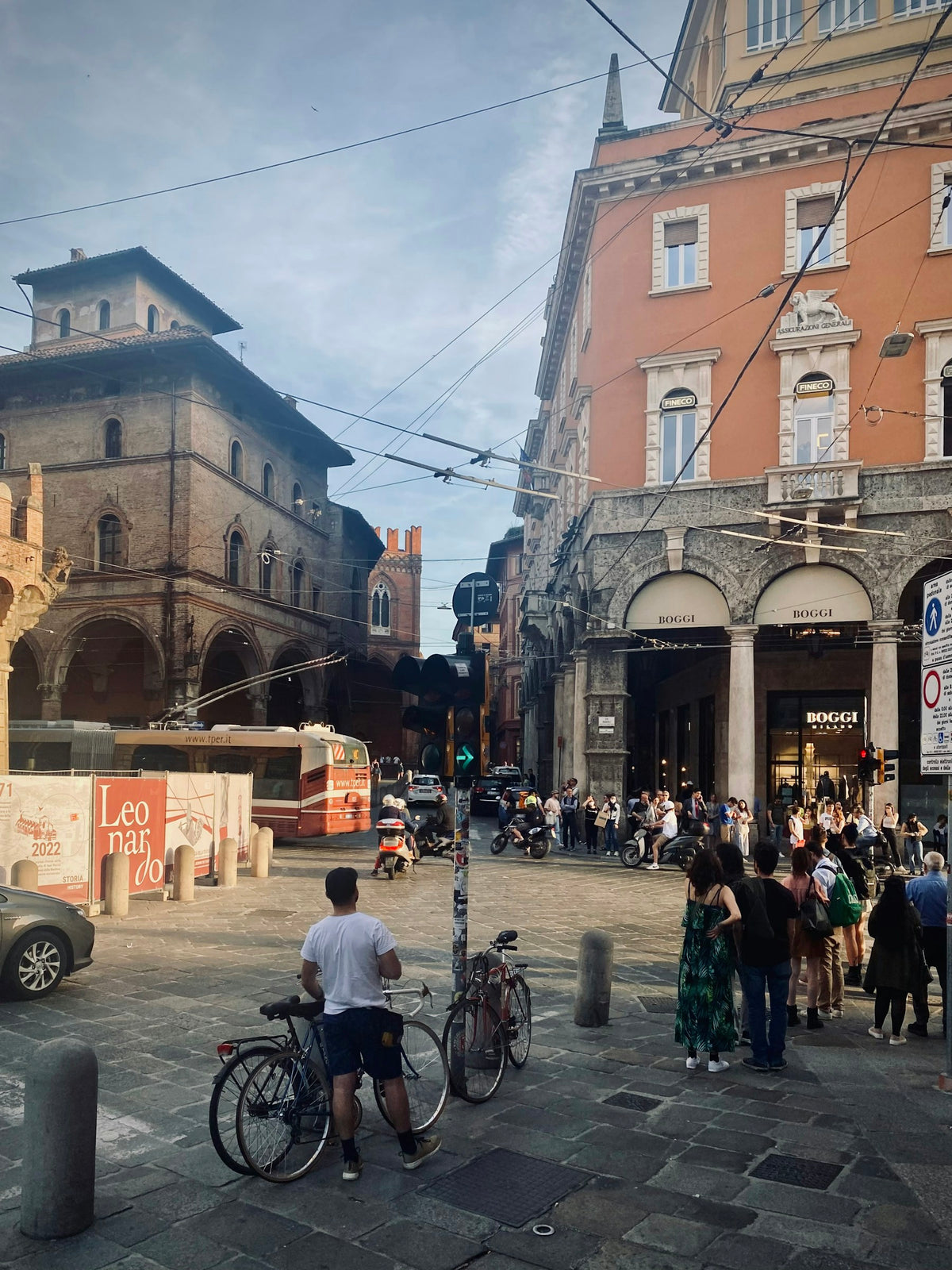 The busy square at the foot of the Two Towers, where Via Rizzoli meets it