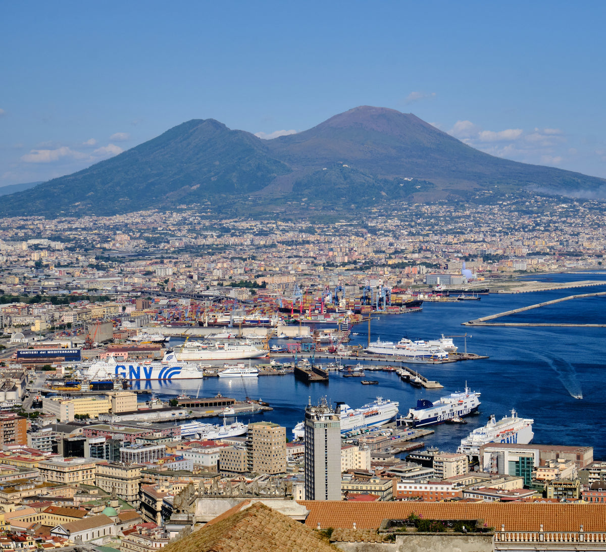 Ferries in the port of Naples below Vesuvius
