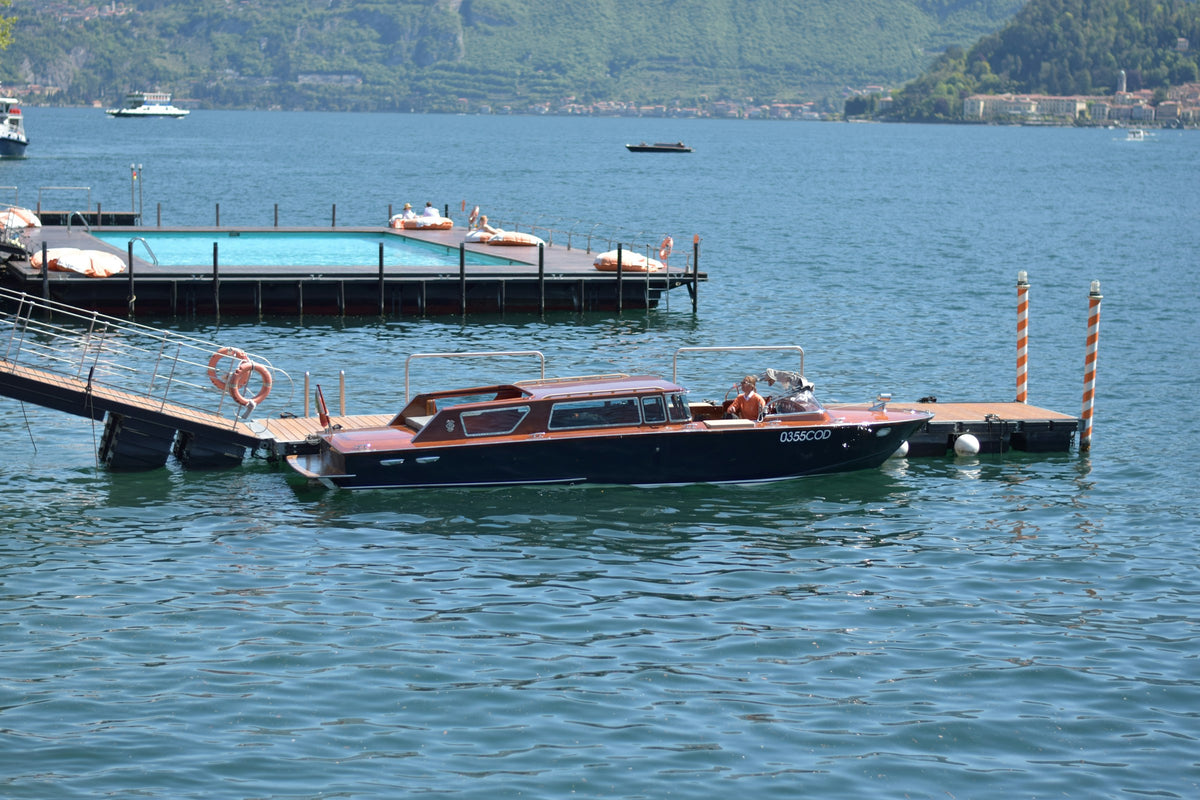 A boat moored at the pier of the Grand Hotel Tremezzo
