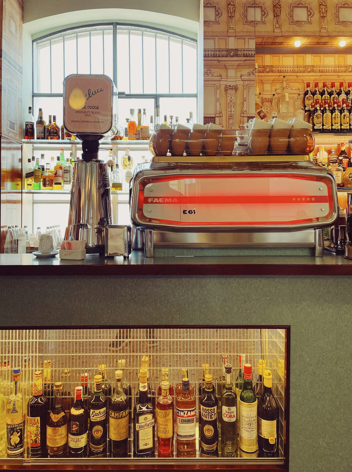 The bottle-lined counter of Bar Luce in Milan