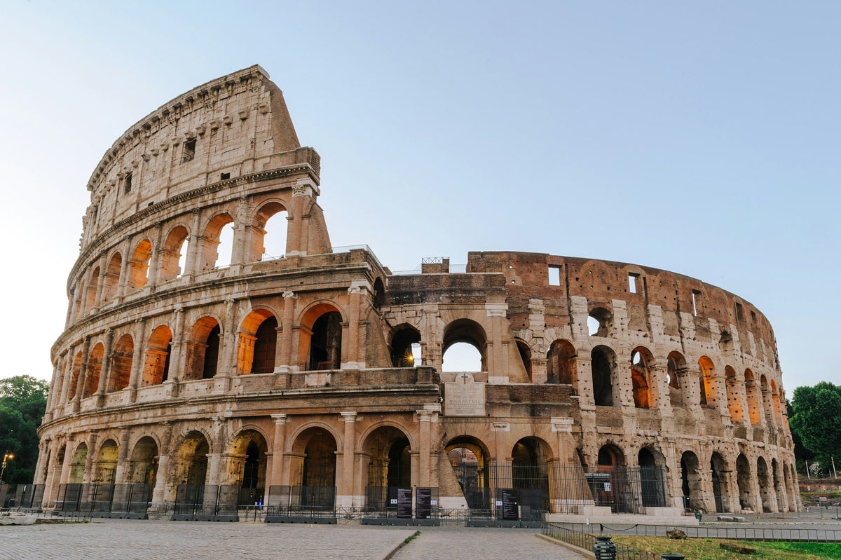 The Colosseum's travertine arches in golden-hour light
