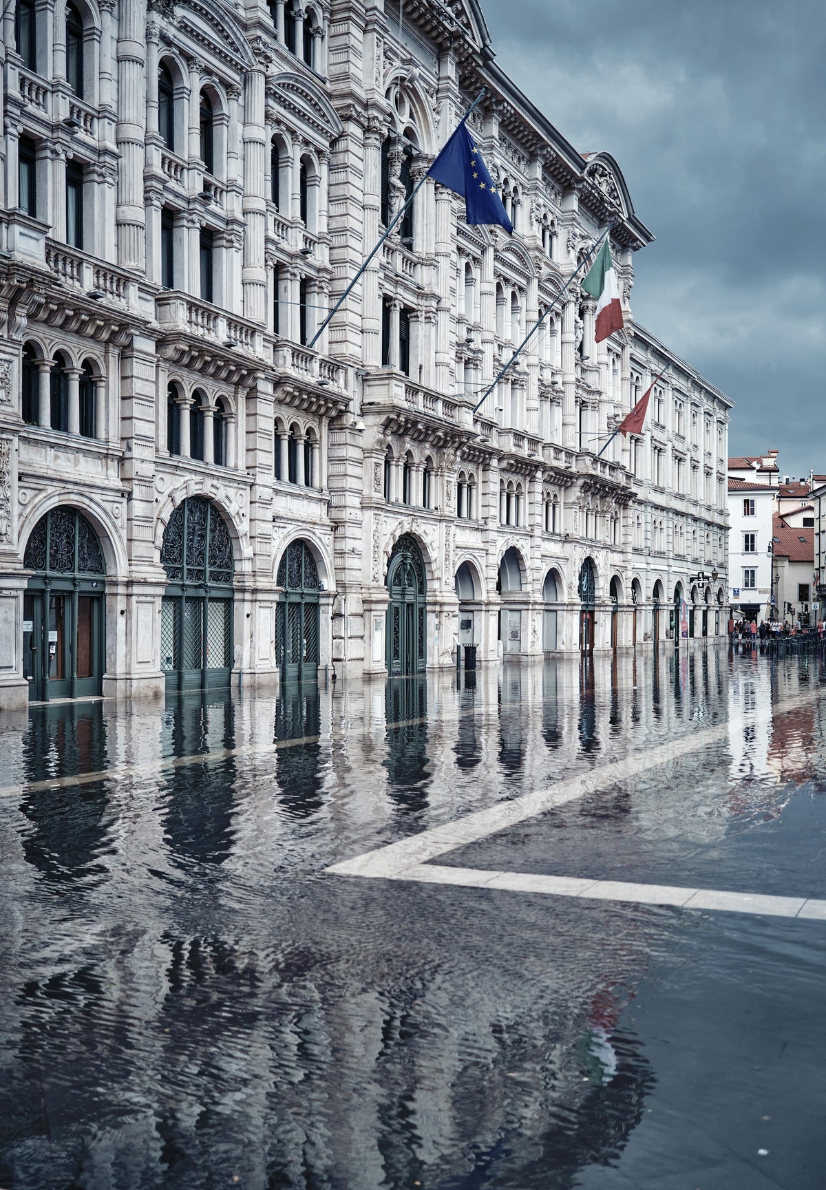 Town Hall reflected on the wet square