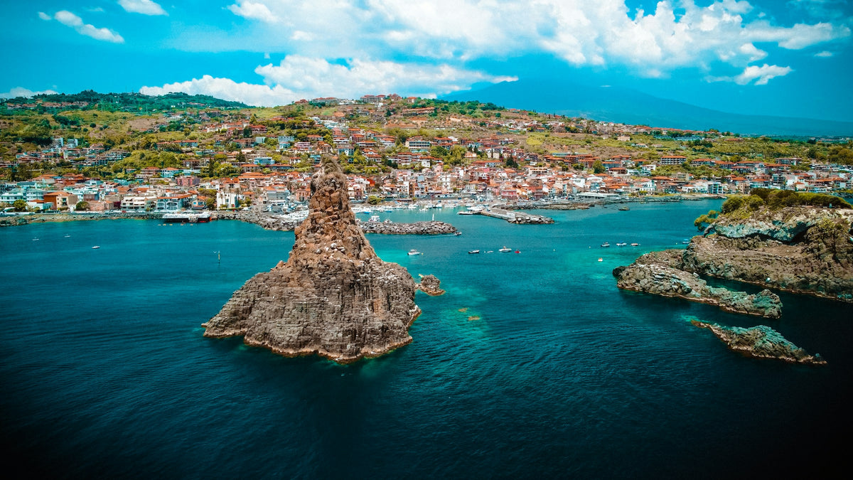 Aci Trezza, its harbour and the Cyclops rocks