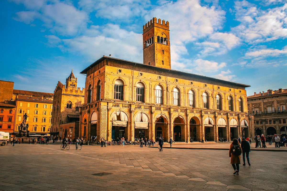 A large historic building with a tower in Bologna