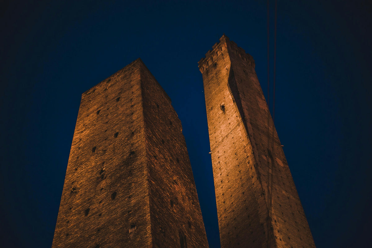 The Asinelli and Garisenda towers seen from below at night