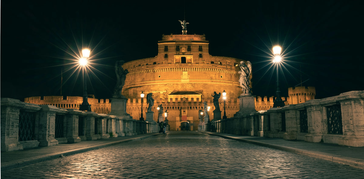 Castel Sant'Angelo lit up at night, seen from Ponte Sant'Angelo