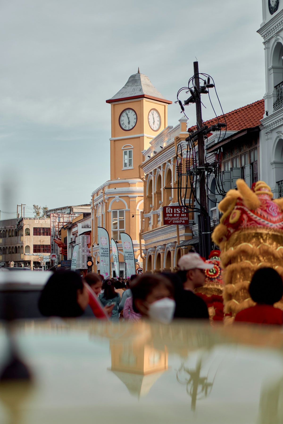 Street life by the clock tower in Phuket Old Town