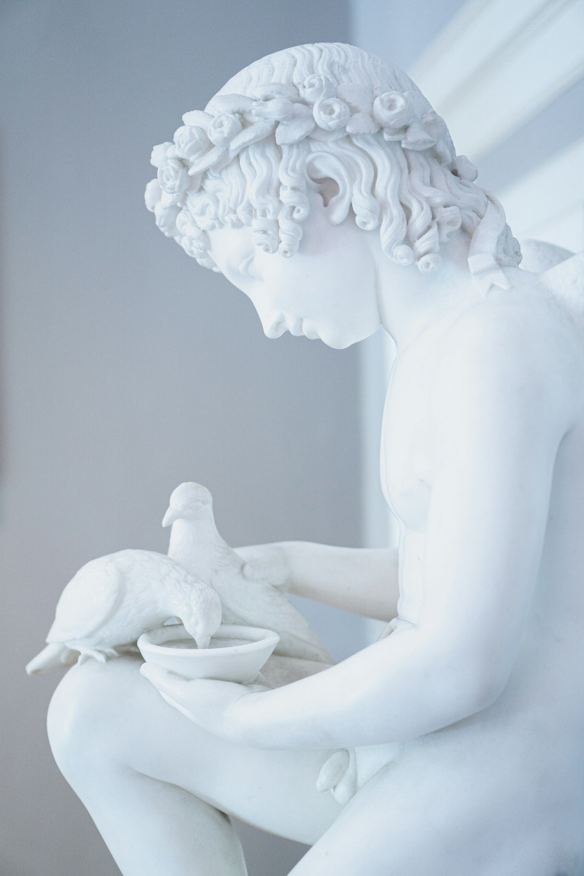 A statue of a boy with a bird in Tremezzo