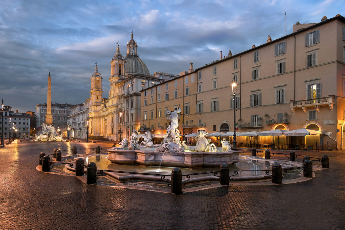 Piazza Navona at dusk, its fountains and Sant'Agnese in Agone