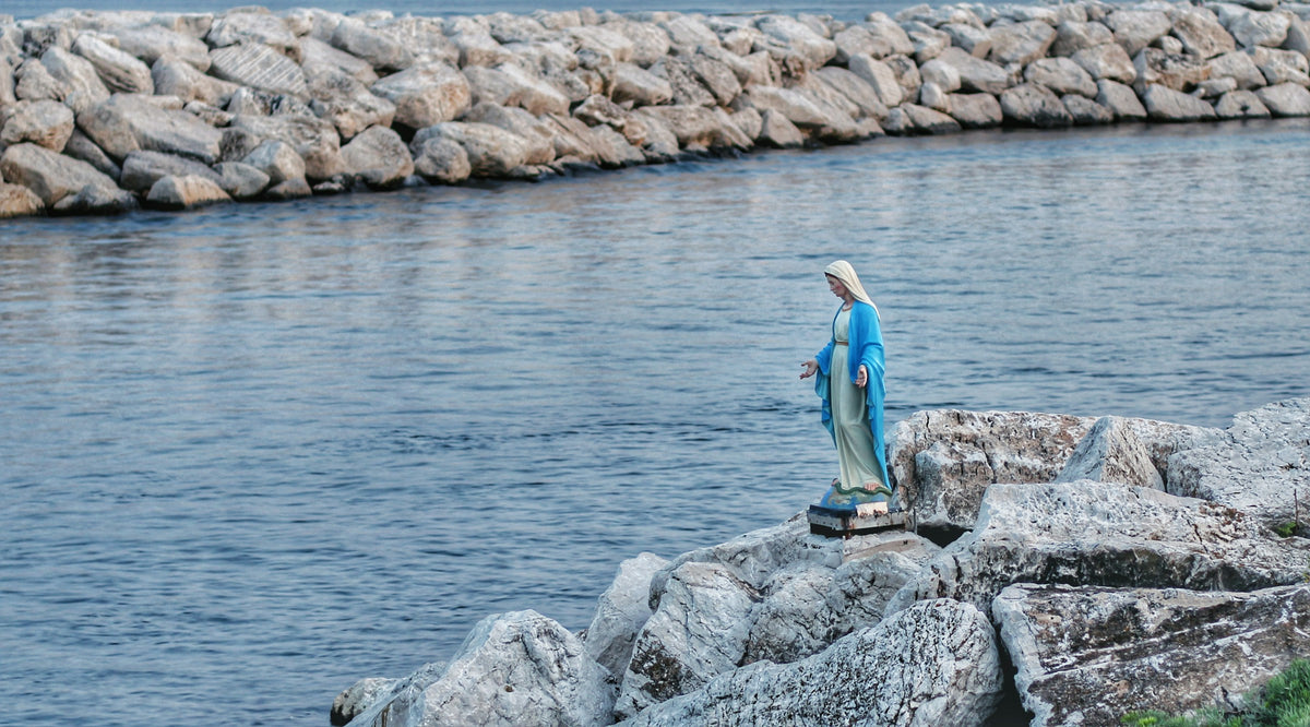 A small Madonna shrine on the seafront rocks