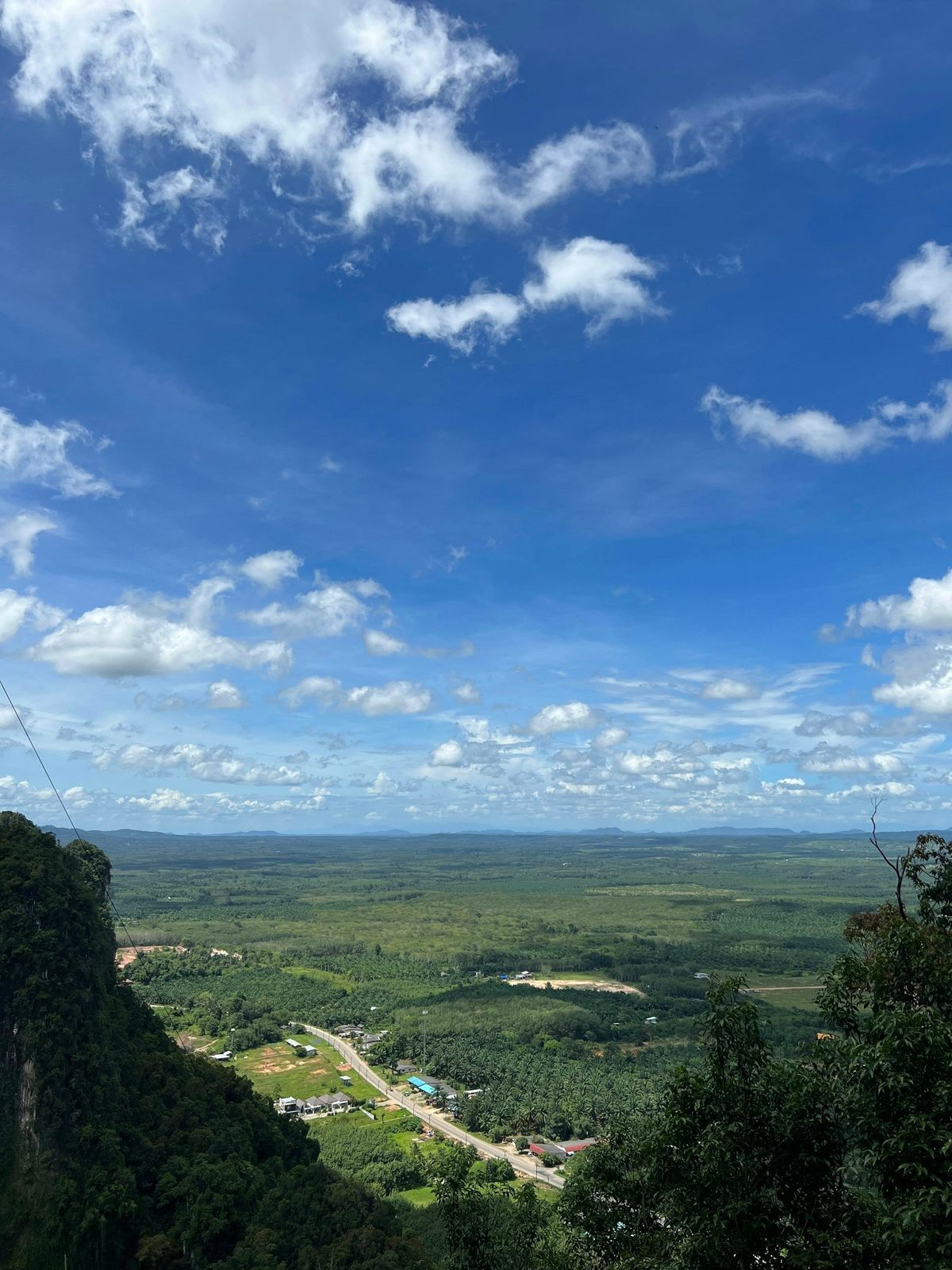 Green plains and hills seen from above in Krabi