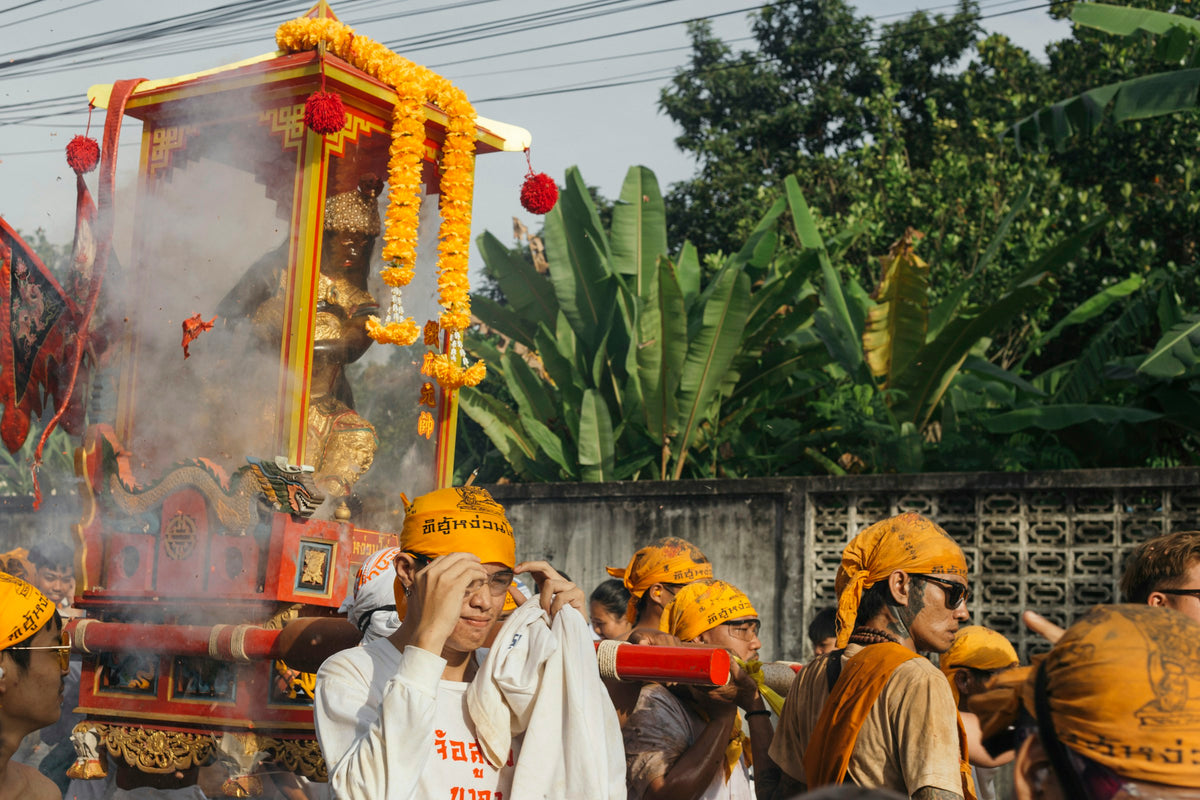 Devotees carrying a deity palanquin during the Phuket Vegetarian Festival