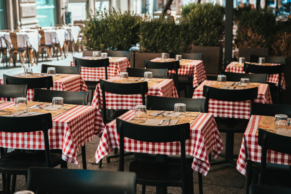 A Bologna restaurant with red and white checkered tablecloths