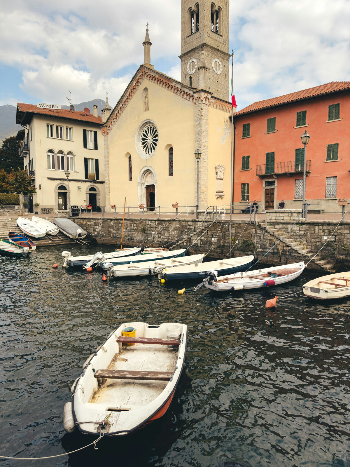 Boats moored in the water at Torno