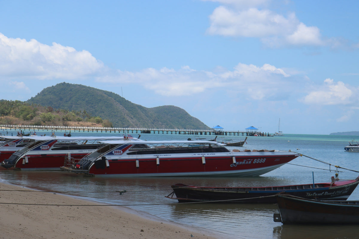 Boats moored by the pier at Rawai, Phuket