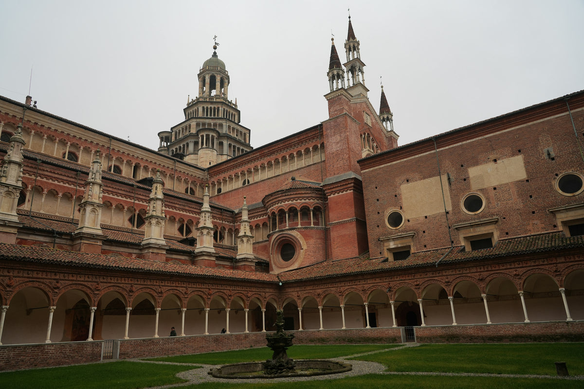 Certosa di Pavia with a fountain in front