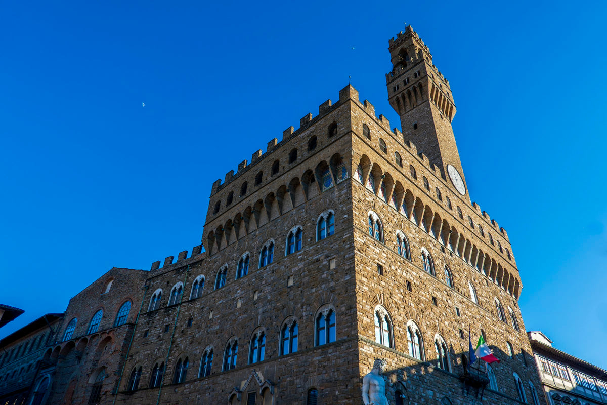 Palazzo Vecchio and its tower against a deep blue sky