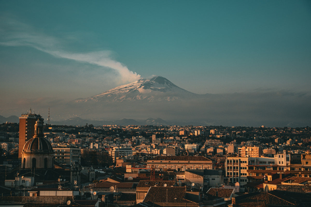 Etna smoking above the rooftops of Catania