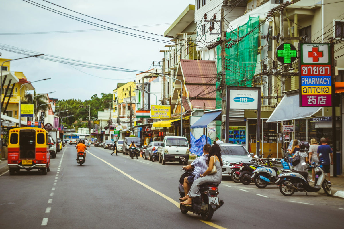 Scooters and traffic on a street in Phuket