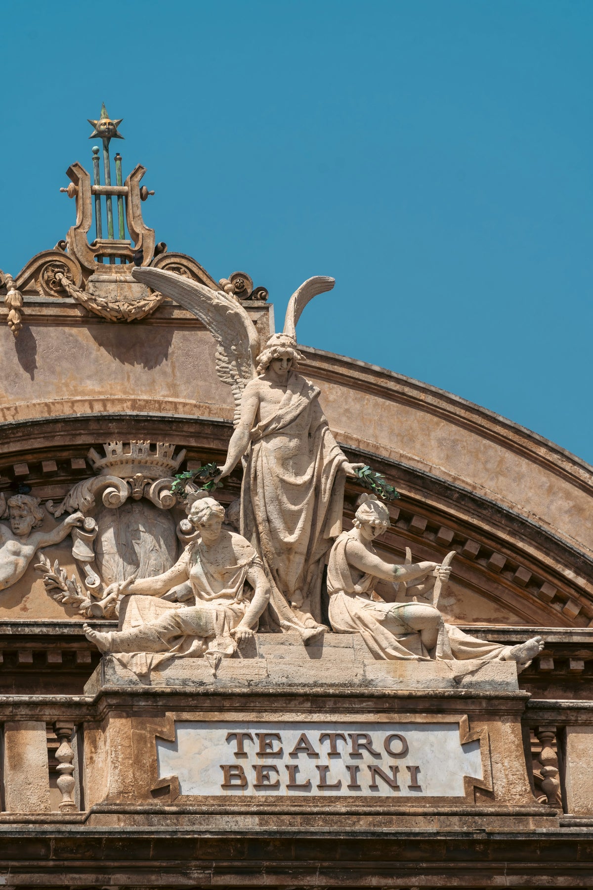 Sculptures crowning the Teatro Massimo Bellini
